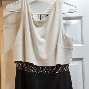 Black and white mini-dress with sheer waist and beaded detailing